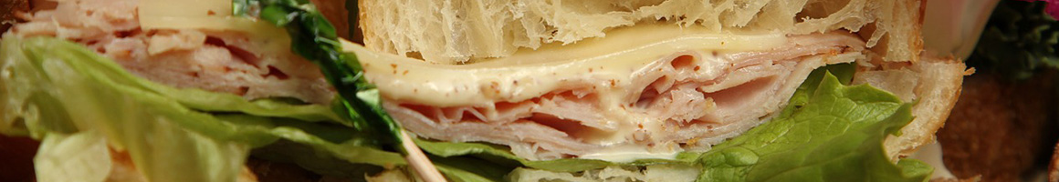 Eating Sandwich at Sandy's Espresso restaurant in Carnation, WA.